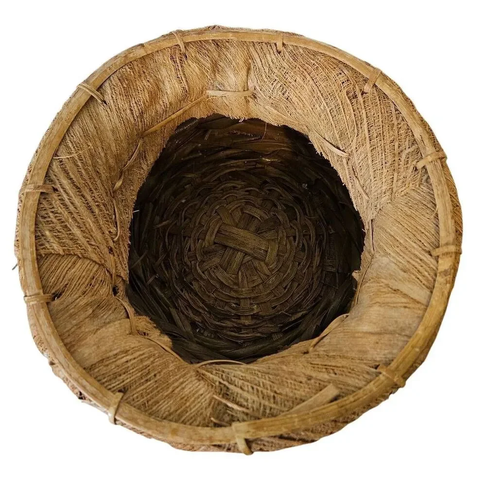 Primitive handmade basket, dried palm leaf woven.